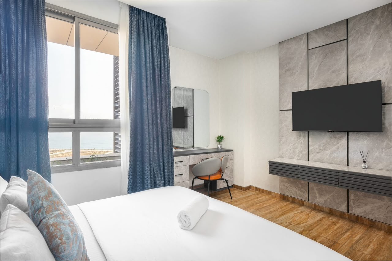 Eko Pearl bedroom with vanity desk and ocean view