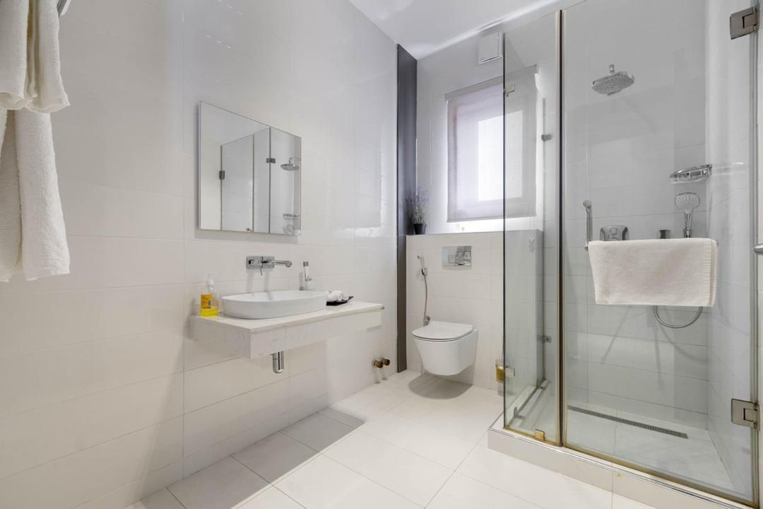 Stylish Lekki 1-bedroom apartment ensuite bathroom with glass shower