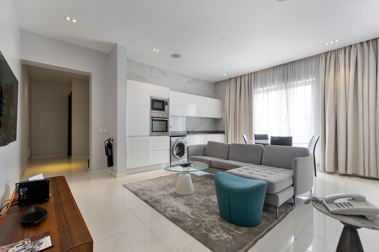Stylish Lekki 1-bedroom apartment lounge and fitted kitchen