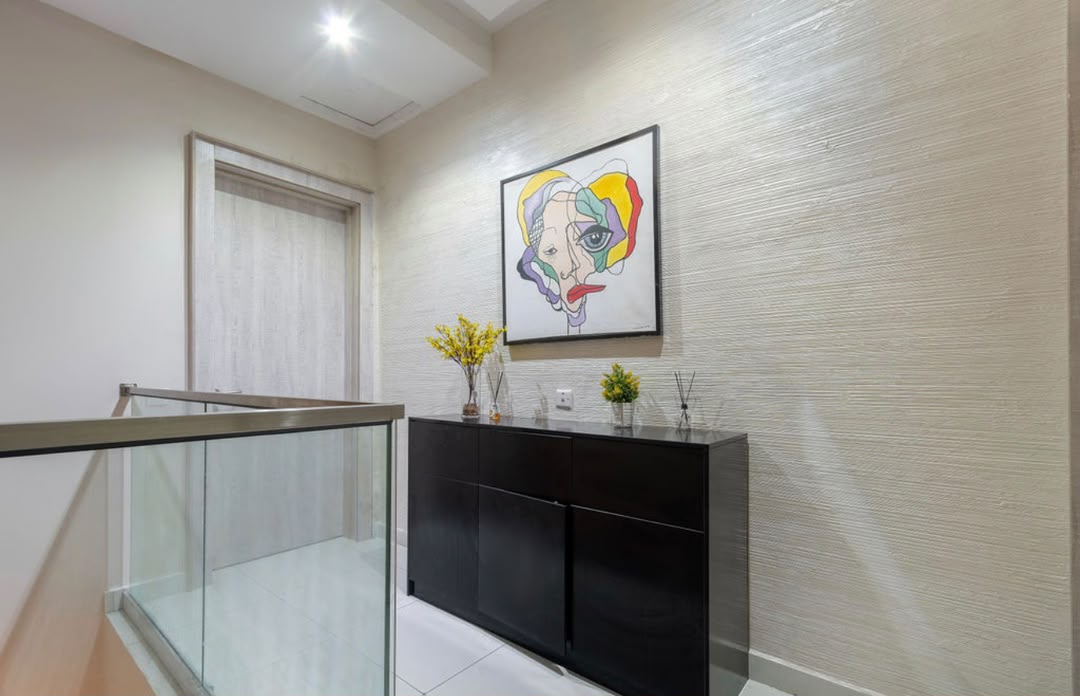 Maisonette stair landing and art wall