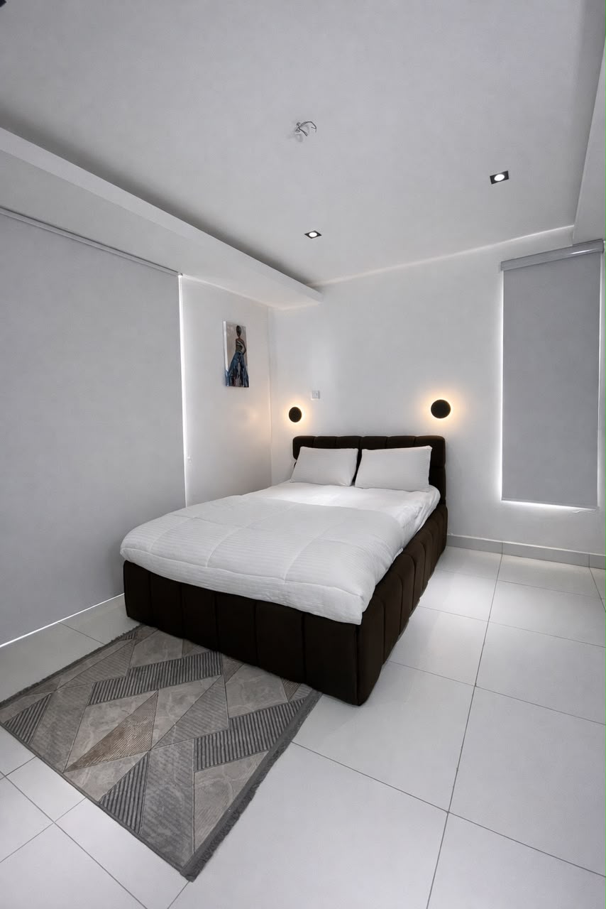 Yaba one-bedroom apartment bedroom with soft lighting